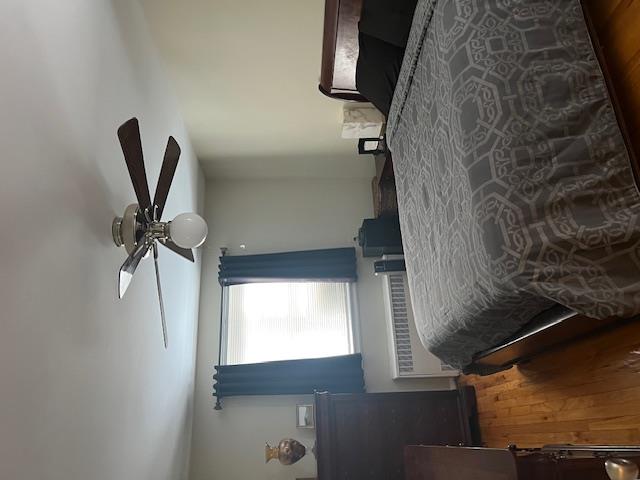87-40 Francis Lewis Boulevard, Unit B4 Queens, NY 11427 - Photo 2 of 5 a bedroom with a bed and a window