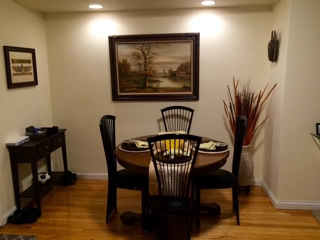 87-40 Francis Lewis Boulevard, Unit B4 Queens, NY 11427 - Photo 5 of 5 a view of a dining room with furniture and wooden floor