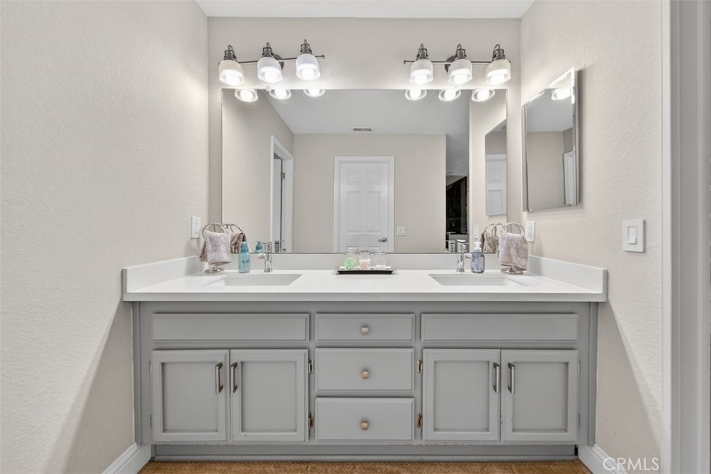 1395 3rd Street Gilroy, CA 95020 - Photo 5 of 39 a bathroom with a sink double vanity and a mirror