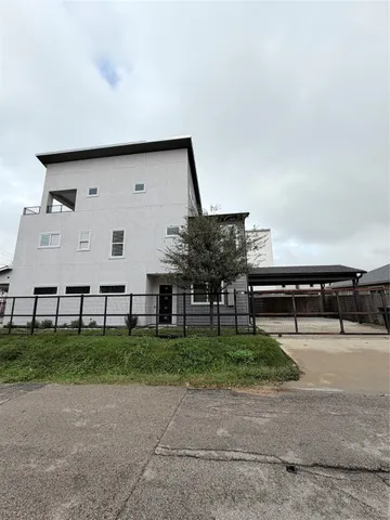 a group of chairs in front of house
