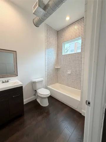 a bathroom with a toilet sink and bathtub
