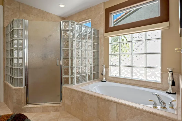 a bathroom with a bathtub and a shower
