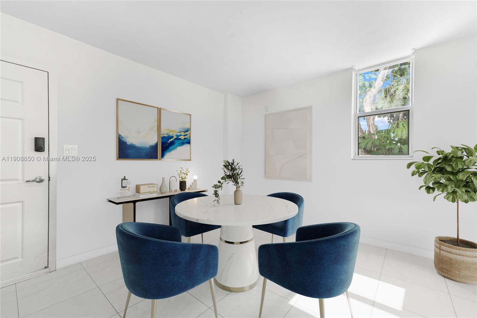 650 Northeast 64th Street, Unit G208 Miami, FL 33138 - Photo 2 of 8 a view of a dining room with furniture and a potted plant