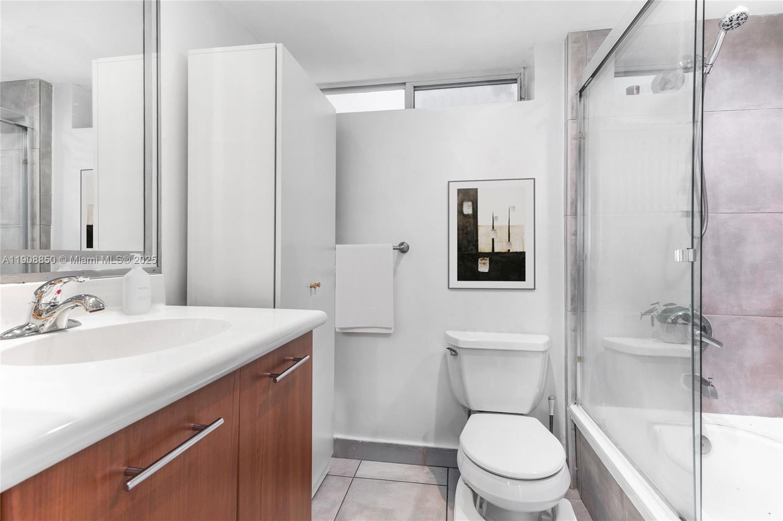 650 Northeast 64th Street, Unit G208 Miami, FL 33138 - Photo 5 of 8 a bathroom with a sink a toilet and shower