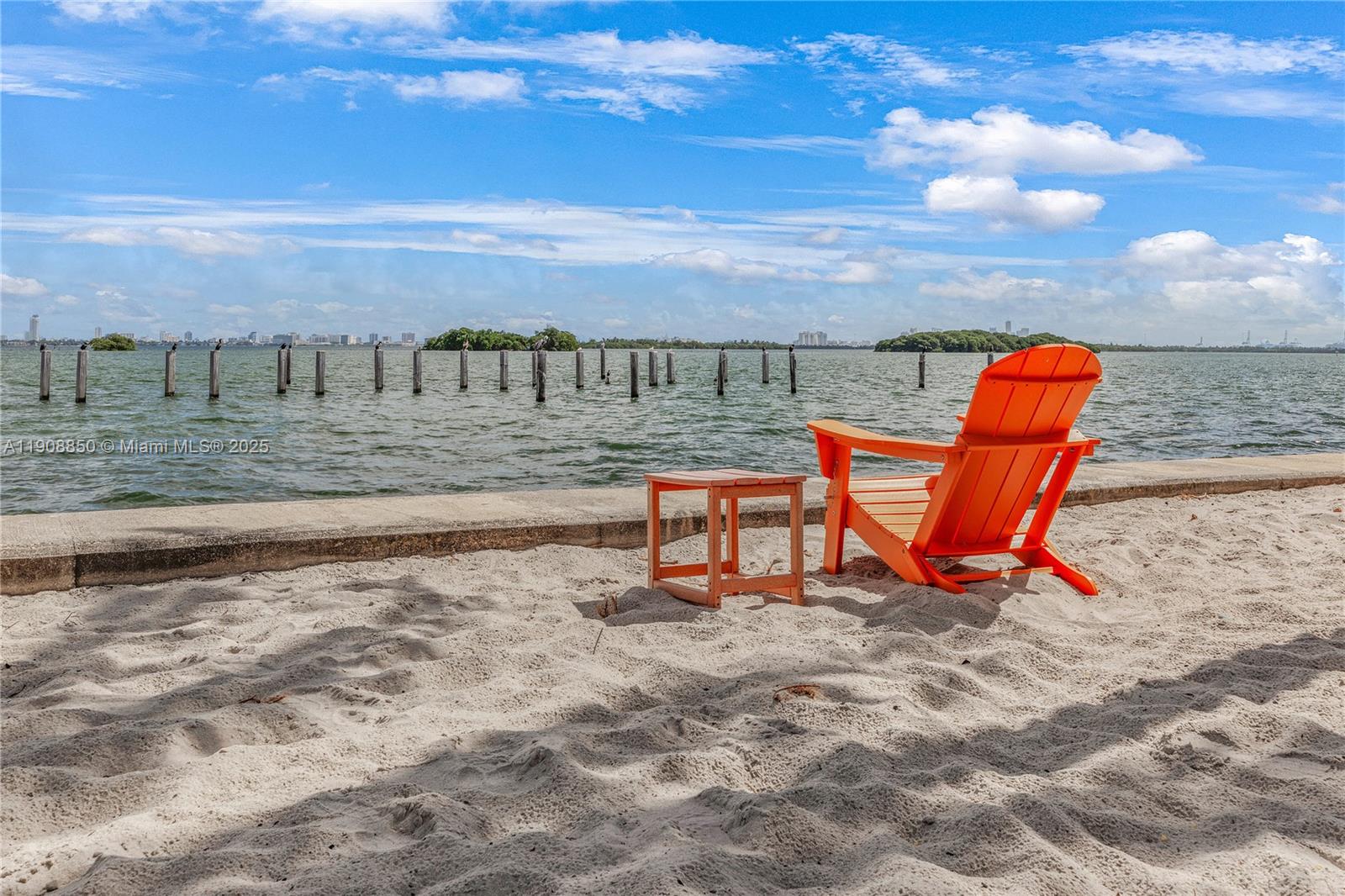 650 Northeast 64th Street, Unit G208 Miami, FL 33138 - Photo 6 of 8 a bench is sitting in the middle of a yard