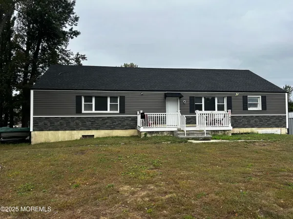 a front view of a house with a swimming pool