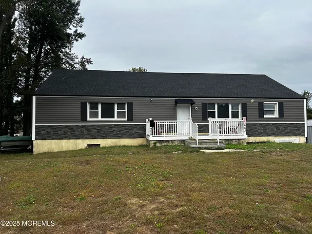 a front view of a house with a swimming pool