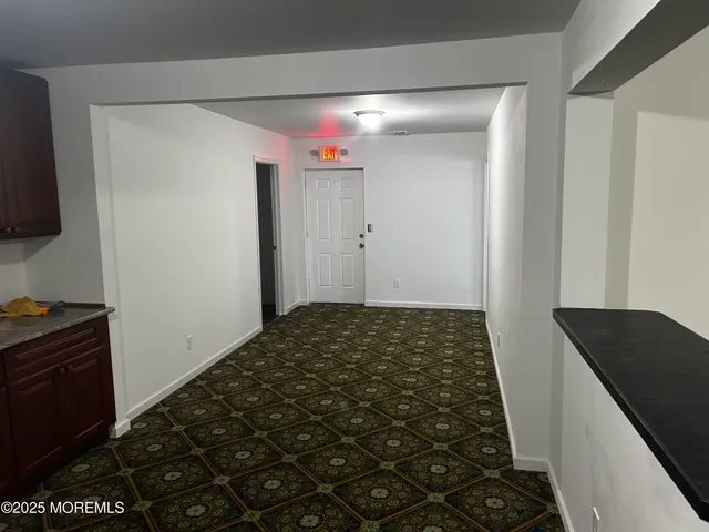 a bathroom with a black and white checkered floor