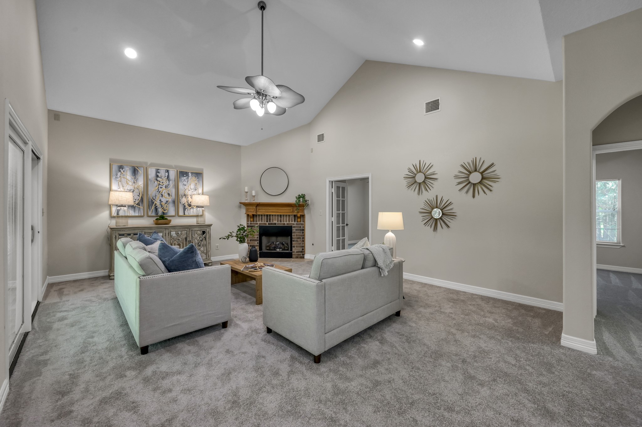 9606 Miller Road Magnolia, TX 77354 - Photo 19 of 41 The main family room is the larger of the two living areas. Gas log fireplace, access to the covered porch and just off the kitchen so everyone can visit and enjoy time together.