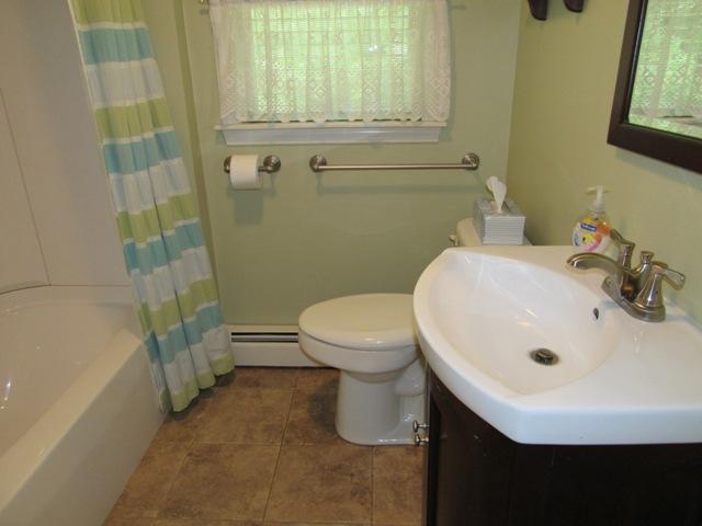 24 Spectacle Pond Road East Wareham, MA 02538 - Photo 21 of 32 a bathroom with a sink a toilet and shower