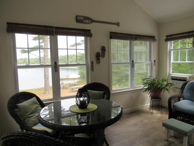 24 Spectacle Pond Road East Wareham, MA 02538 - Photo 10 of 32 a living room with furniture and floor to ceiling windows
