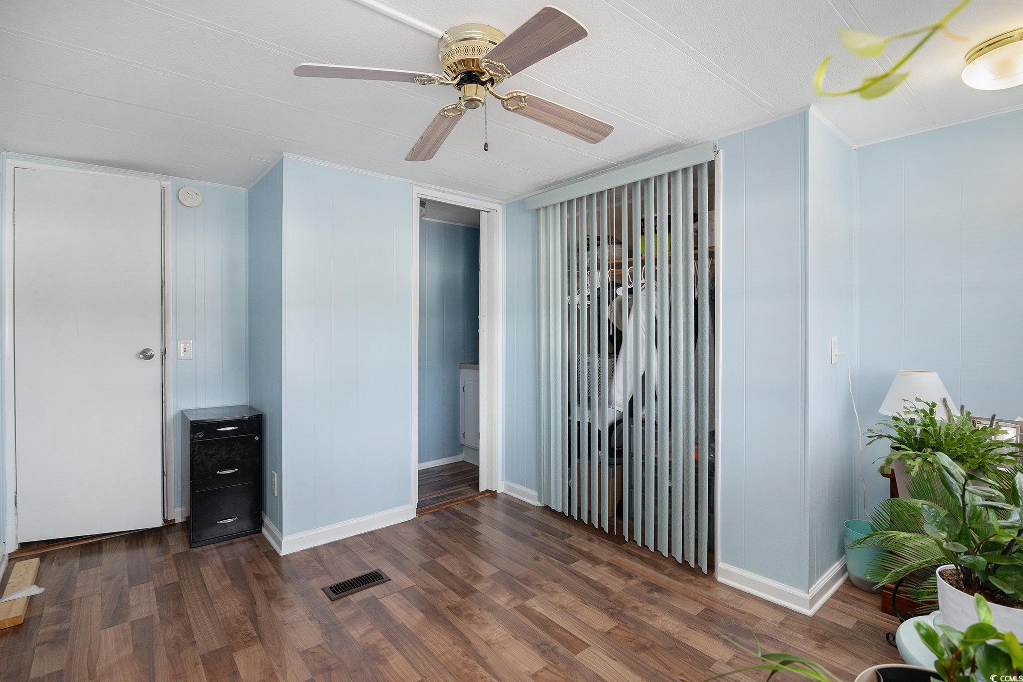 63 Saxon Court Murrells Inlet, SC 29576 - Photo 11 of 22 Bedroom with dark wood-style floors, a ceiling fan, and ornamental molding