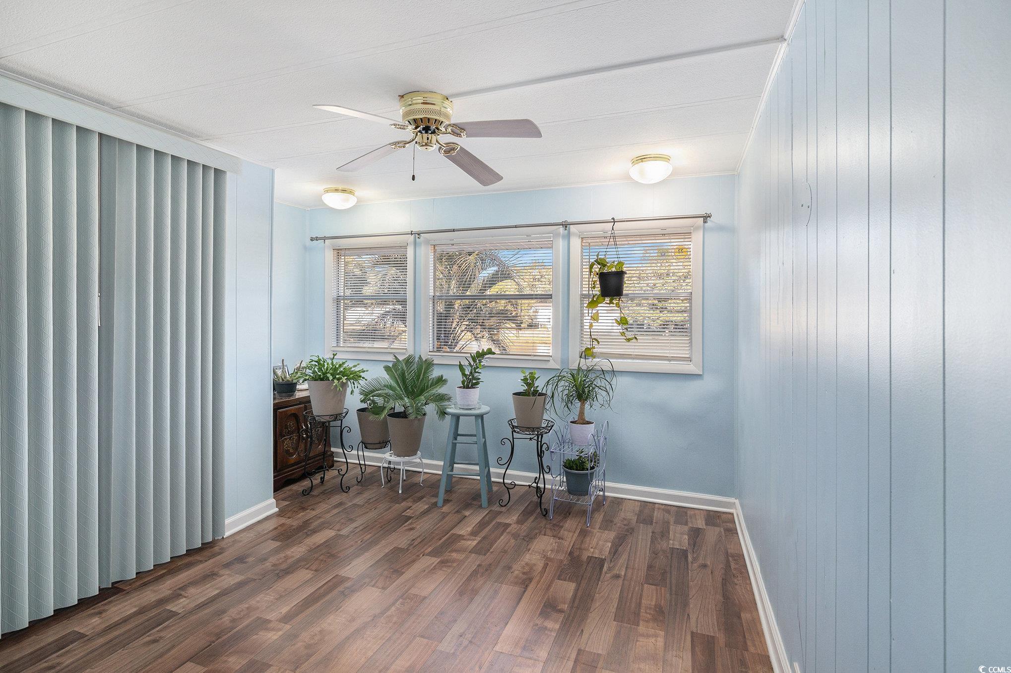 63 Saxon Court Murrells Inlet, SC 29576 - Photo 12 of 22 Unfurnished bedroom featuring wood finished floors and ceiling fan