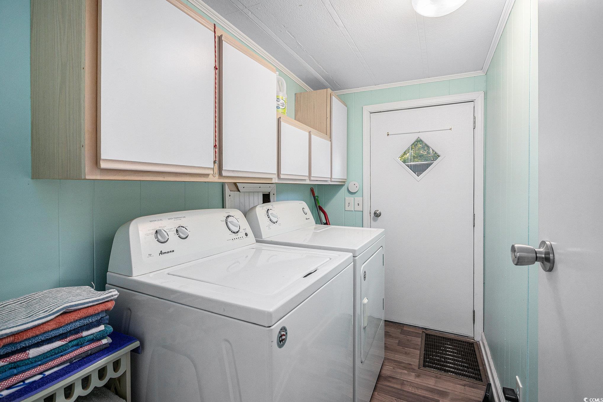 63 Saxon Court Murrells Inlet, SC 29576 - Photo 14 of 22 Bathroom featuring a shower with curtain, double vanity, and light wood-type flooring
