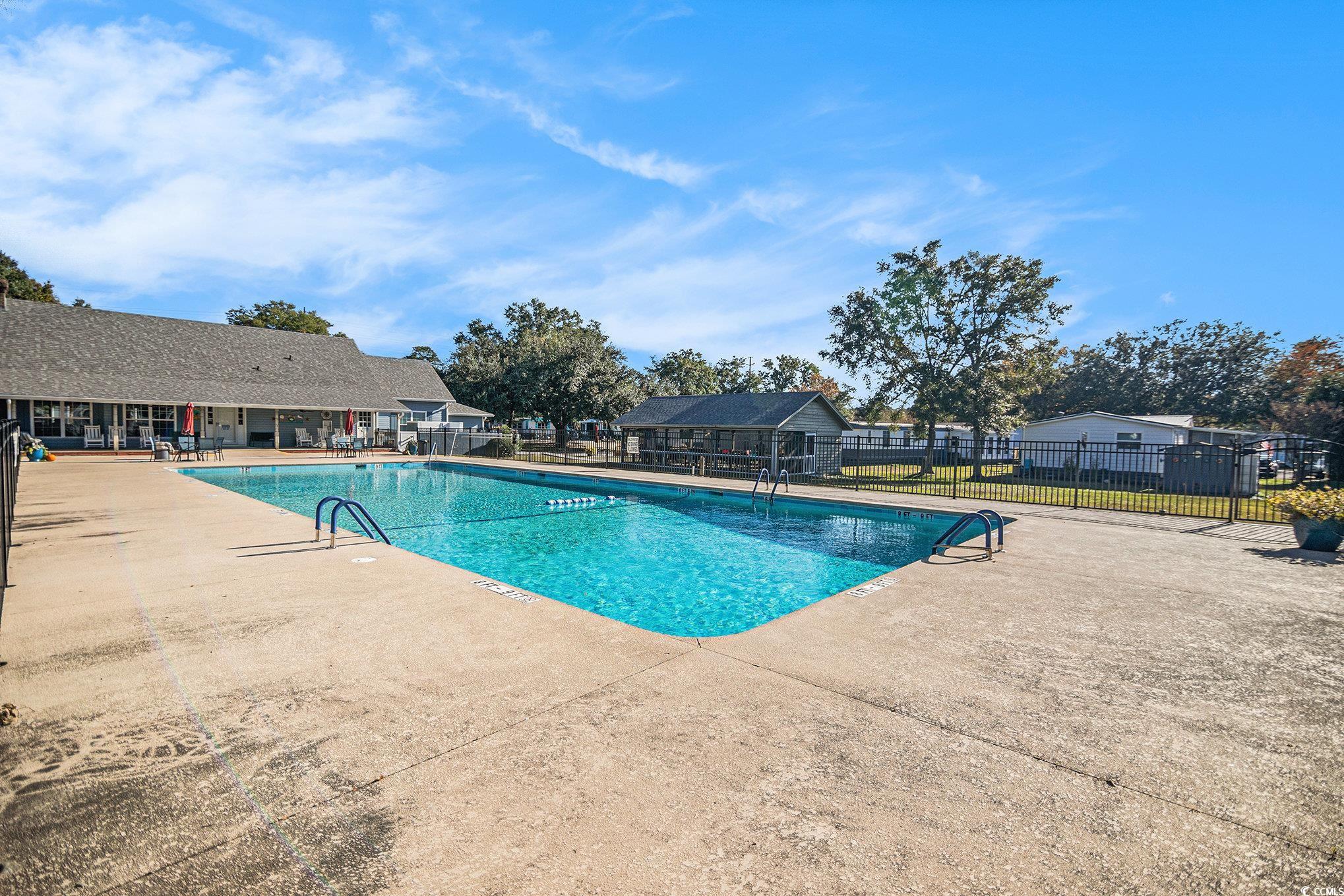 63 Saxon Court Murrells Inlet, SC 29576 - Photo 17 of 22 View of asphalt driveway featuring street lighting