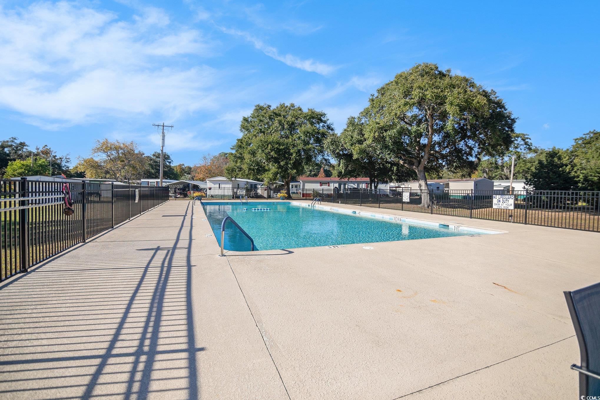 63 Saxon Court Murrells Inlet, SC 29576 - Photo 18 of 22 Community pool featuring a patio area
