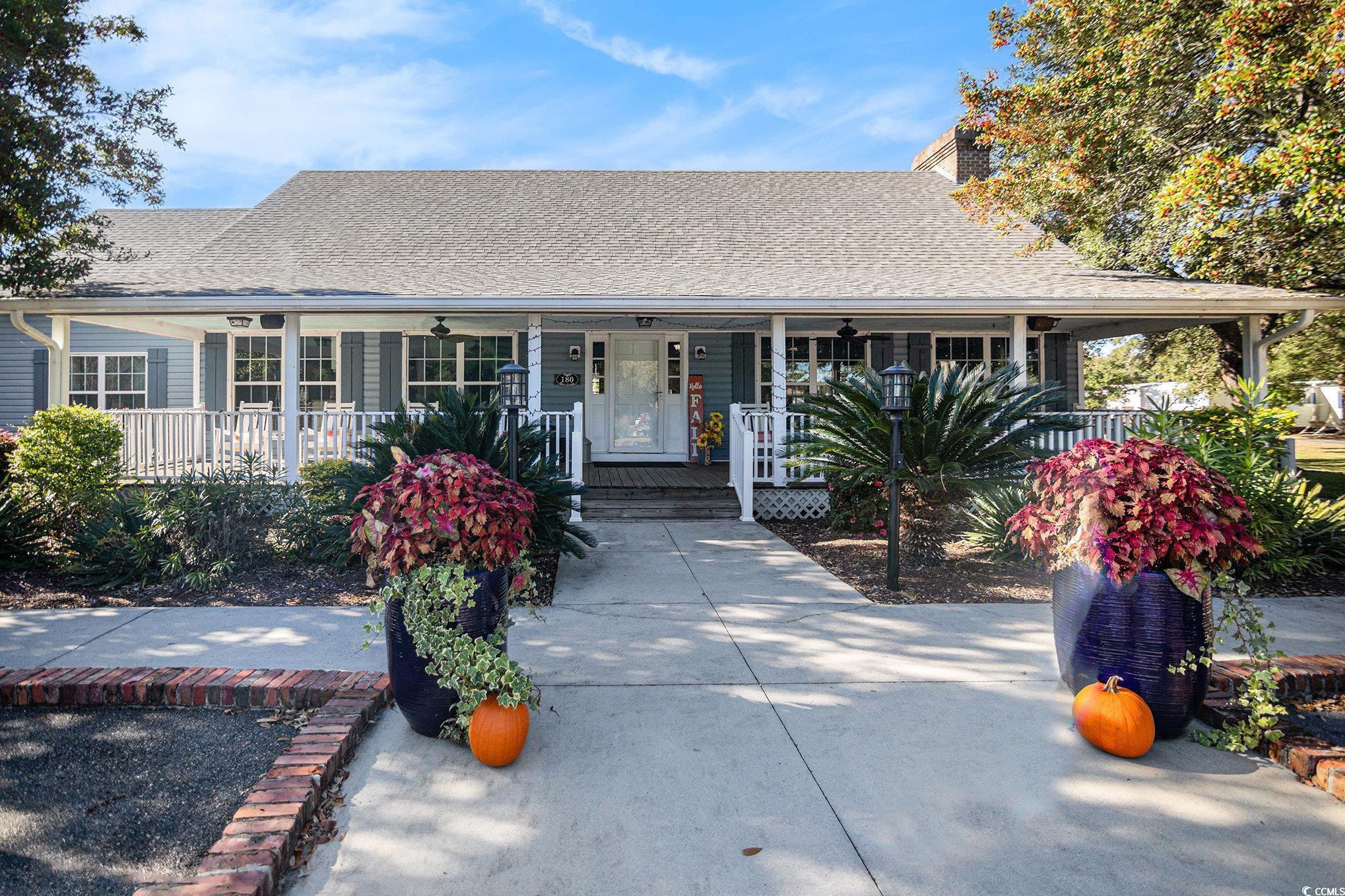 63 Saxon Court Murrells Inlet, SC 29576 - Photo 22 of 22 View of yard featuring a patio area and a sunroom