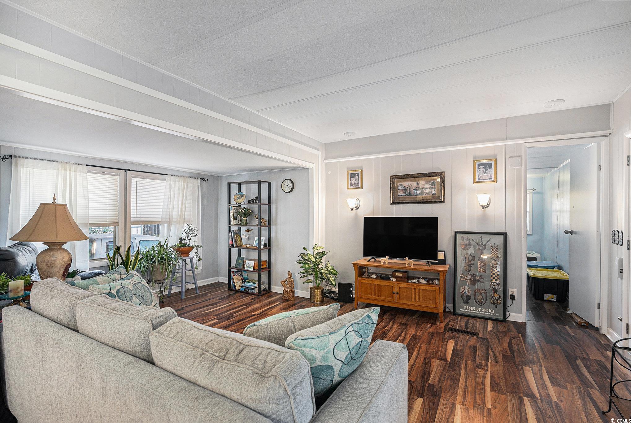 63 Saxon Court Murrells Inlet, SC 29576 - Photo 5 of 22 Kitchen featuring white cabinetry, electric range oven, dark wood-style floors, and light stone counters