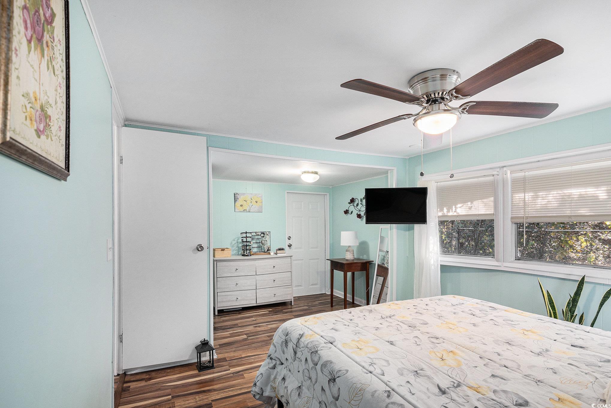 63 Saxon Court Murrells Inlet, SC 29576 - Photo 10 of 22 Bedroom featuring a closet, dark wood-type flooring, and ceiling fan
