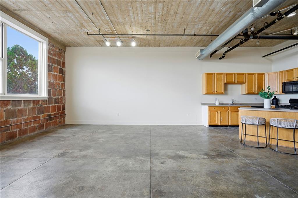 505 Whitehall Street Southwest, Unit 307 Atlanta, GA 30303 - Photo 11 of 37 a view of a livingroom with furniture and a window