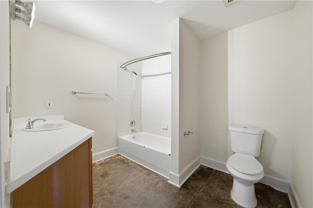 505 Whitehall Street Southwest, Unit 307 Atlanta, GA 30303 - Photo 21 of 37 a bathroom with a sink toilet and shower