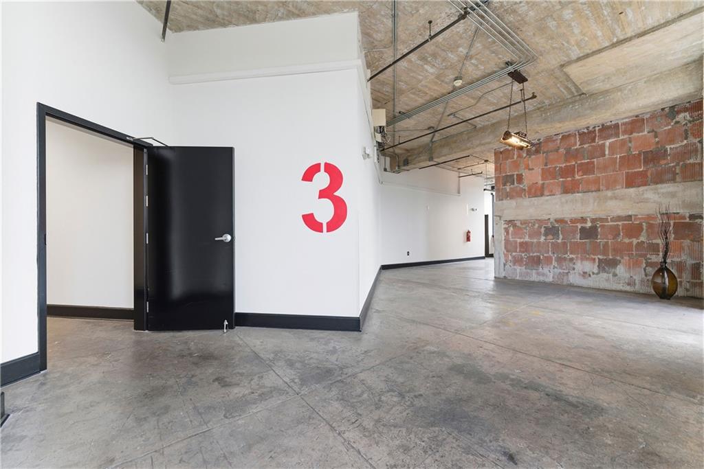 505 Whitehall Street Southwest, Unit 307 Atlanta, GA 30303 - Photo 22 of 35 a view of an empty room with a garage