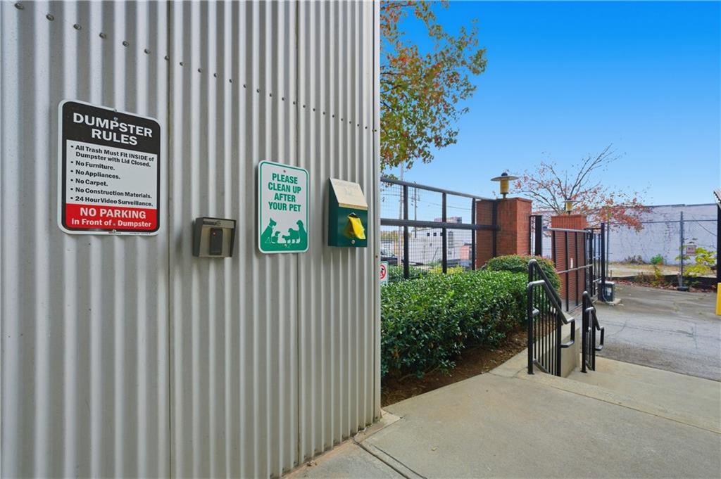505 Whitehall Street Southwest, Unit 307 Atlanta, GA 30303 - Photo 35 of 37 a view of a street with potted plants on both side of it