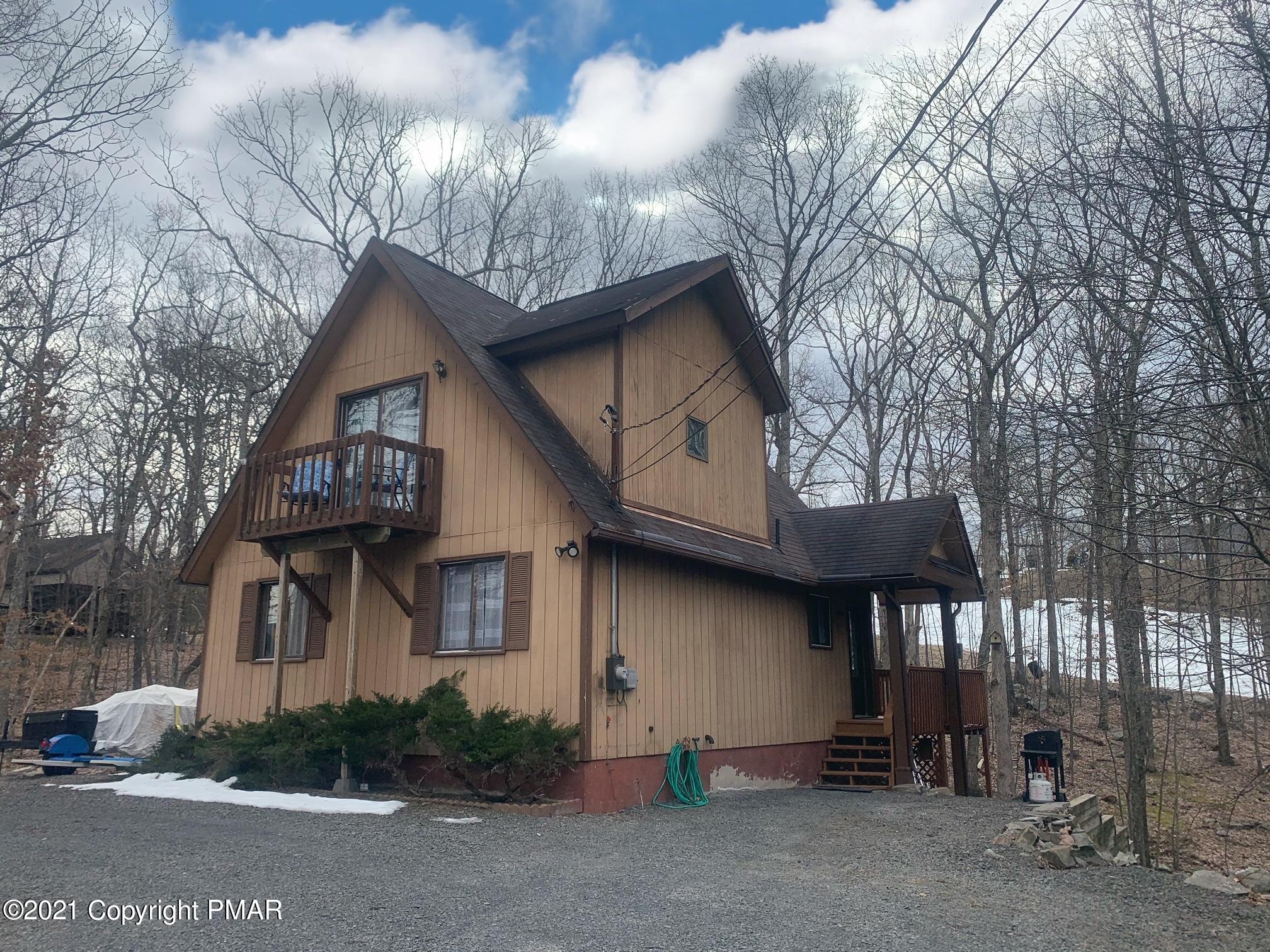 1090 Hampstead Road Bushkill, PA 18324 - Photo 1 of 24 a front view of a house with garden