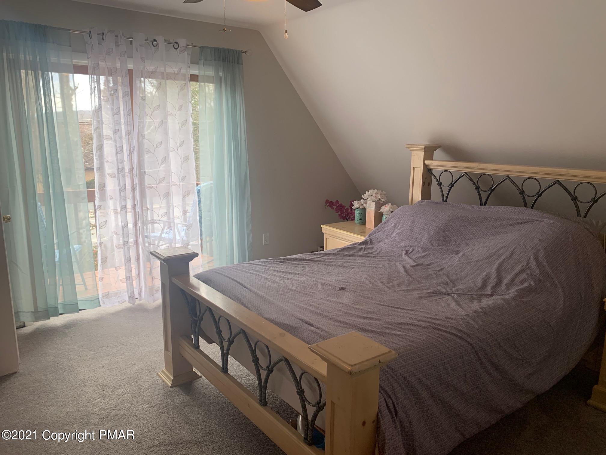 1090 Hampstead Road Bushkill, PA 18324 - Photo 12 of 24 a bedroom with a bed and a window