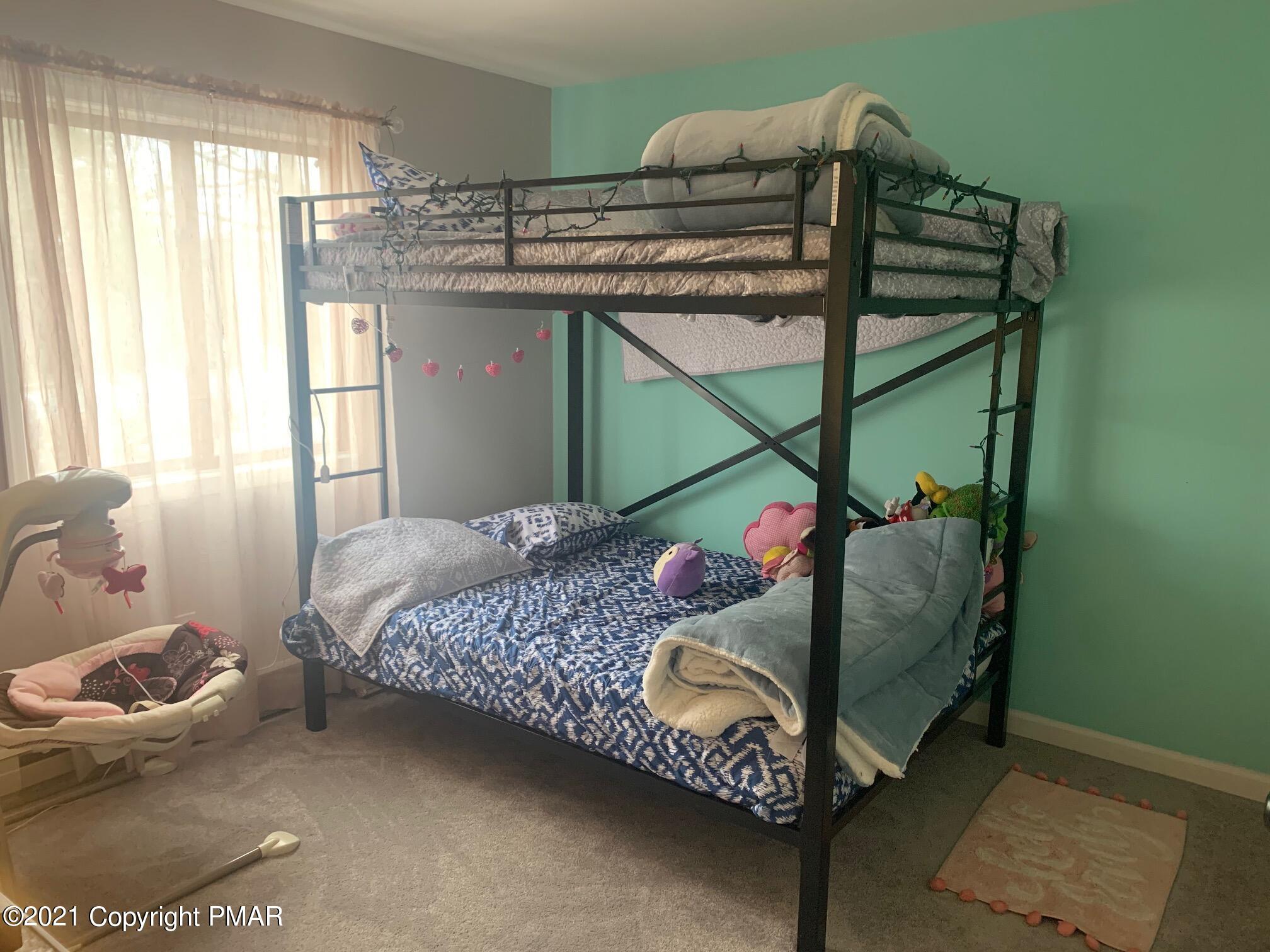1090 Hampstead Road Bushkill, PA 18324 - Photo 15 of 24 a bedroom with a bed and a window