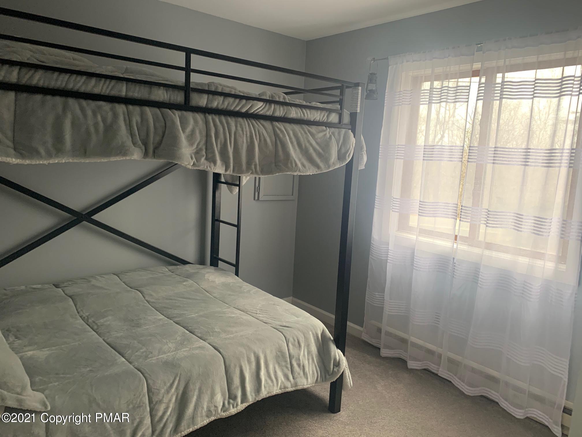 1090 Hampstead Road Bushkill, PA 18324 - Photo 16 of 24 a bedroom with a bed and a window