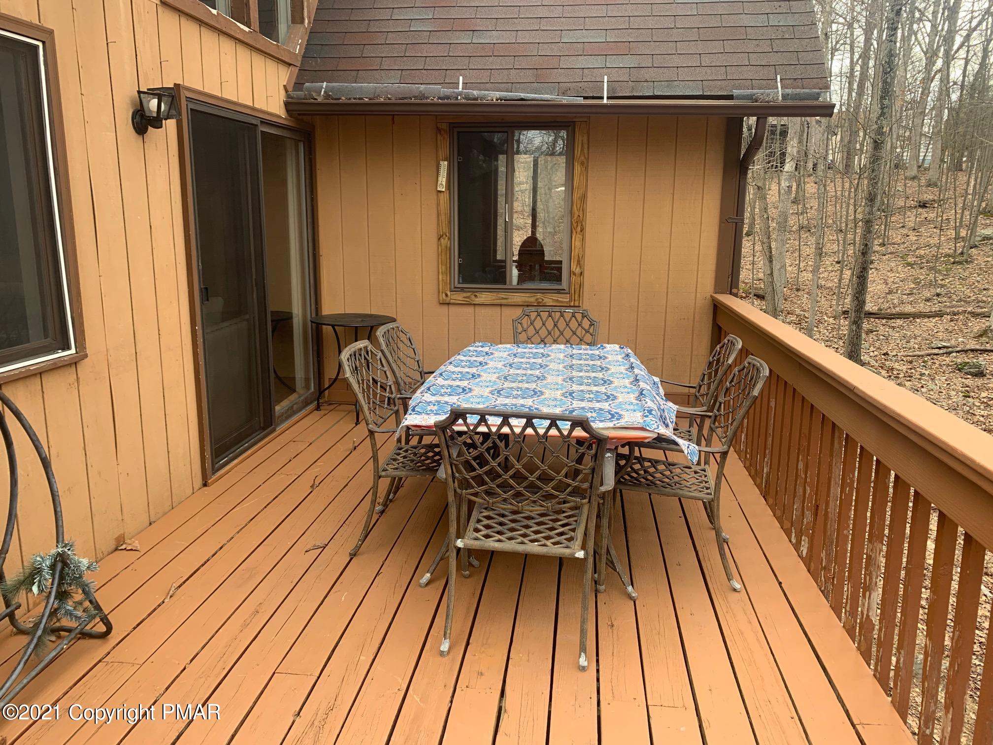 1090 Hampstead Road Bushkill, PA 18324 - Photo 24 of 24 a view of backyard with a deck and wooden floor