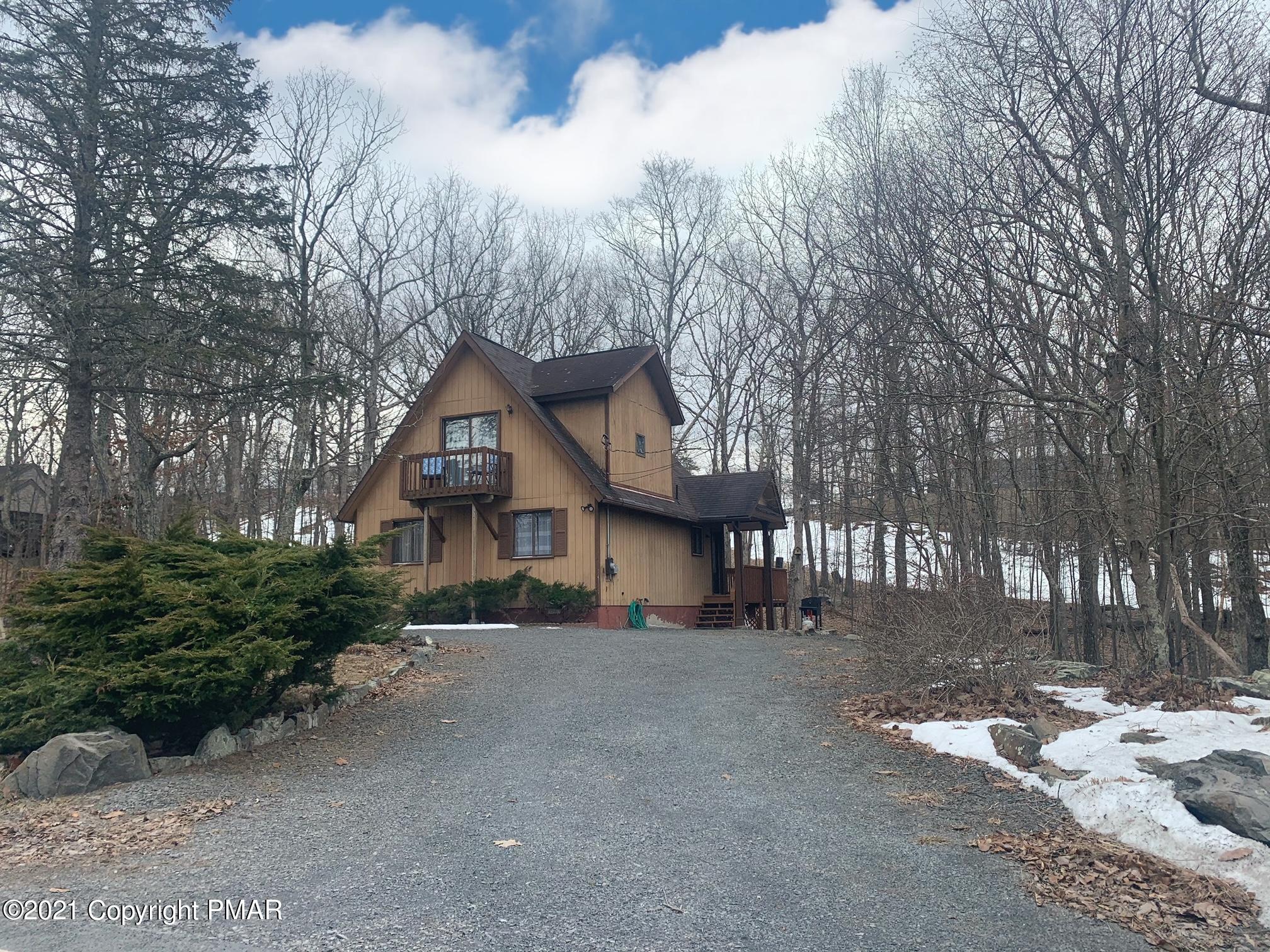 1090 Hampstead Road Bushkill, PA 18324 - Photo 3 of 24 a view of a house with a yard covered in snow