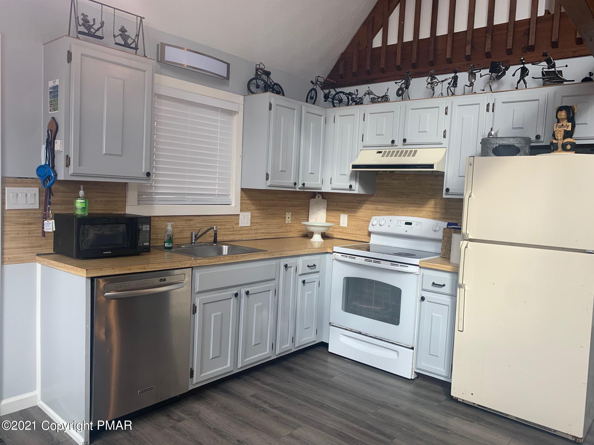 1090 Hampstead Road Bushkill, PA 18324 - Photo 7 of 24 a kitchen with cabinets appliances and a sink