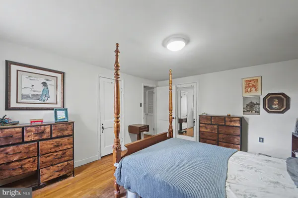 a bed room with a bed and a chair