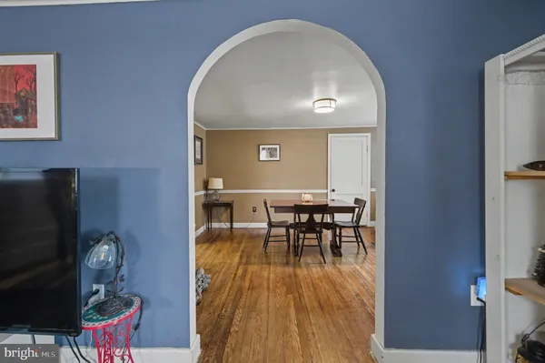 a view of a livingroom with furniture and wooden floor