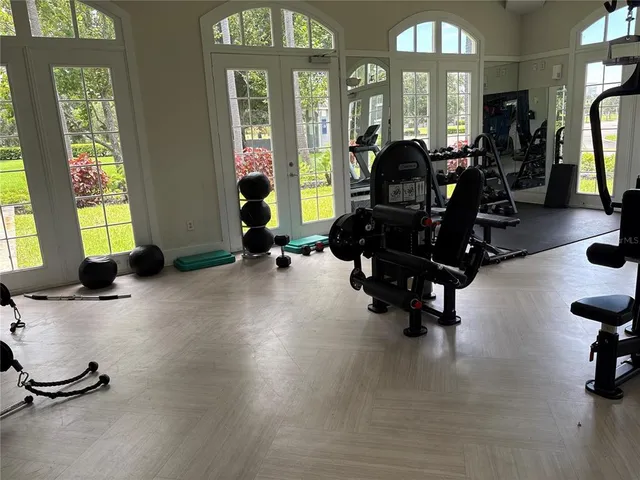 a living room with furniture window and wooden floor
