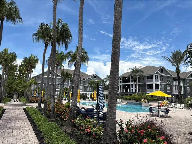 a view of a swimming pool with a patio