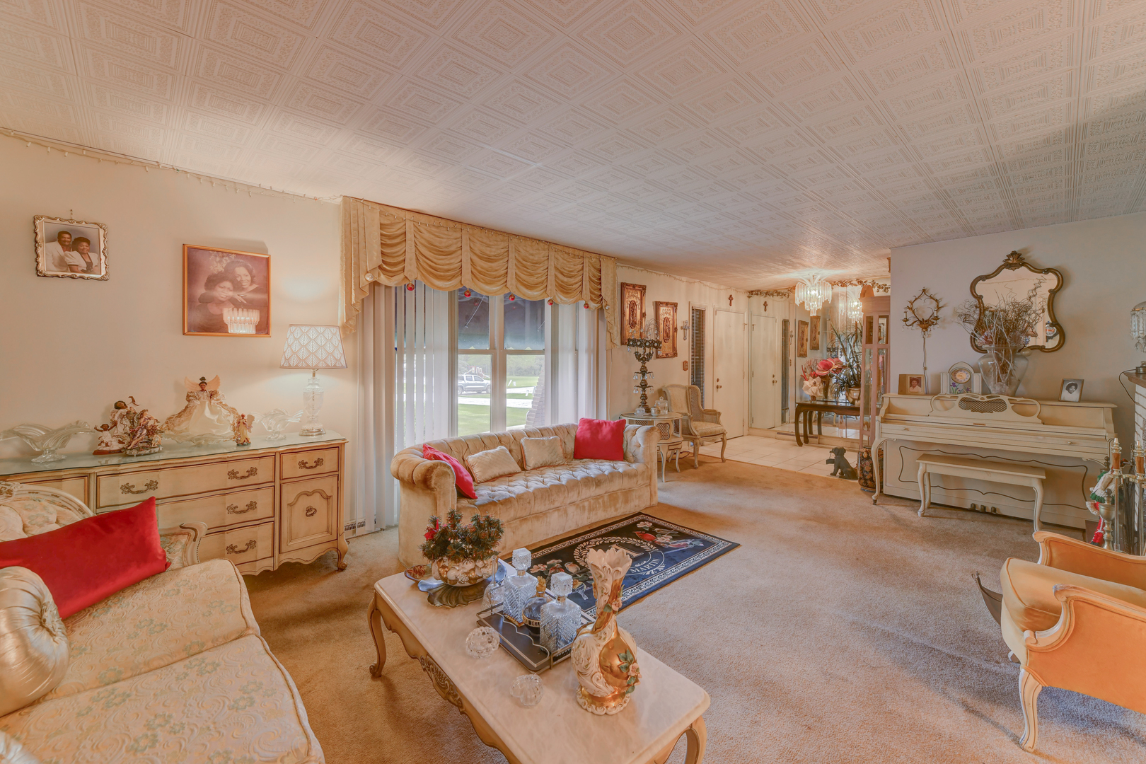 126 Denell Drive Crete, IL 60417 - Photo 11 of 30 a living room with furniture a rug and a dresser