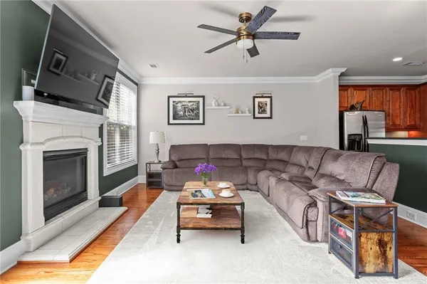 a living room with furniture and a fireplace
