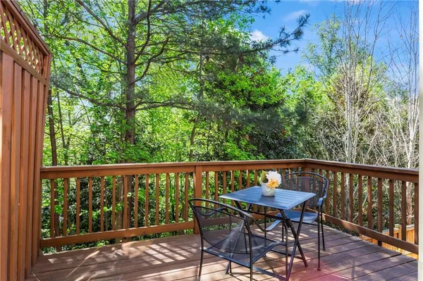 a view of a chairs and table in patio