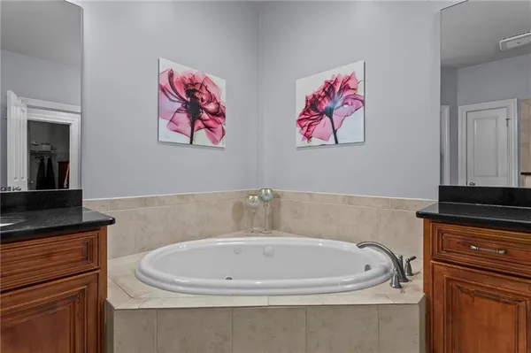 a bathroom with a bathtub and a sink