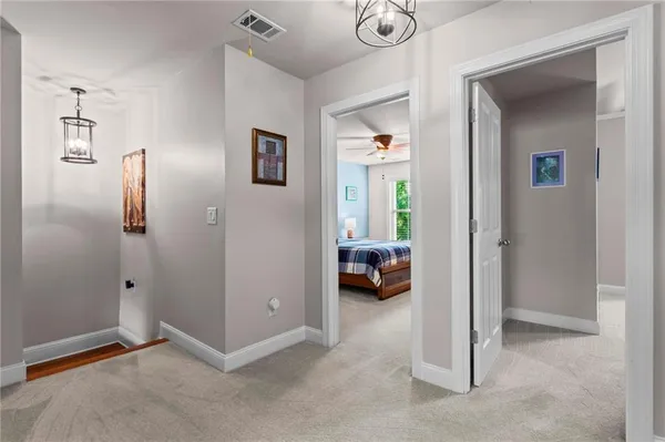 a view of a livingroom with couch and closet