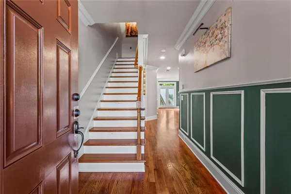 a view of entryway with wooden floor