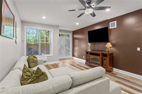 a living room with furniture and a flat screen tv
