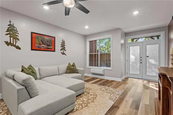 a living room with furniture and windows
