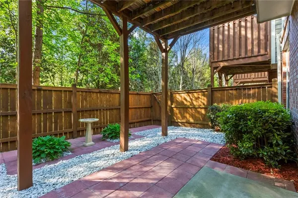 a view of a pathway of a house with a small yard