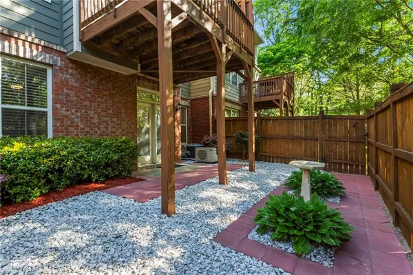 a view of a backyard with potted plants