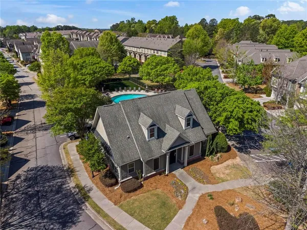 an aerial view of a house with a yard