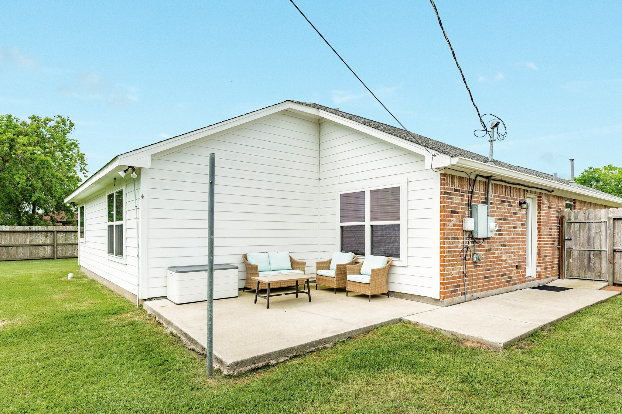 6108 Fox Ridge Drive Angleton, TX 77515 - Photo 22 of 26 a view of a house with a backyard
